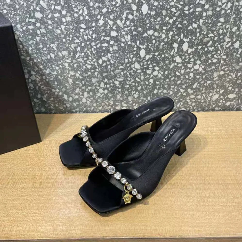 Versace Artifact Mid-Heel Mules for Women in Black Versace Artifact Mid-Heel Mules for Women in Black