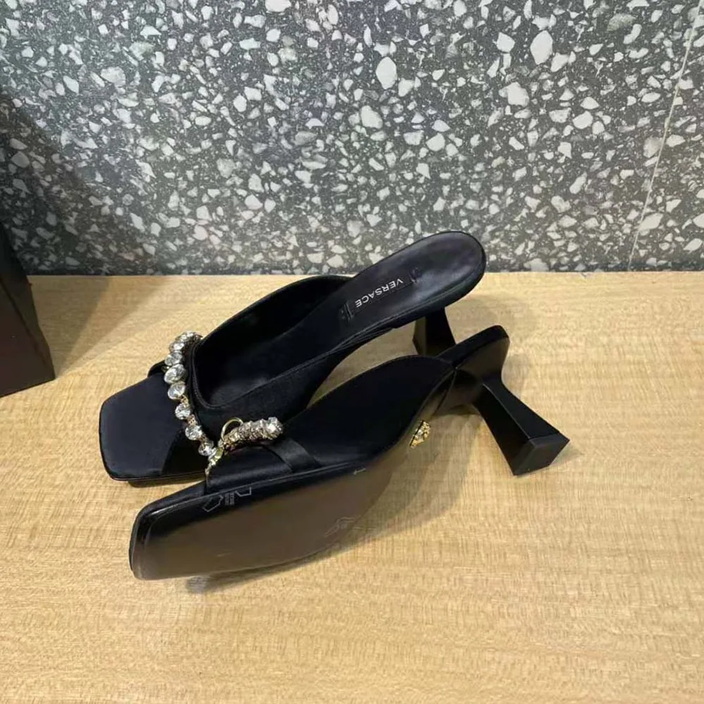 Versace Artifact Mid-Heel Mules for Women in Black Versace Artifact Mid-Heel Mules for Women in Black