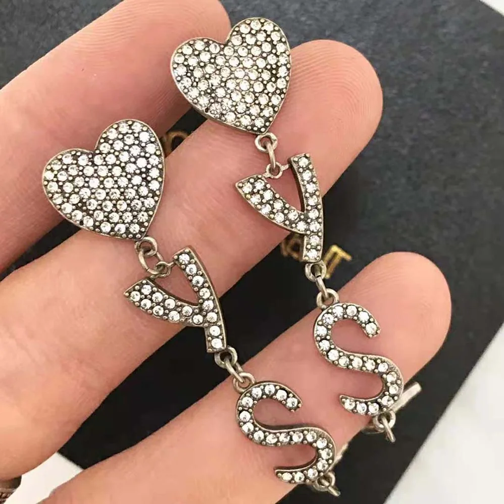 Saint Laurent YSL Opyum YSL Heart Earrings in Metal and Crystal for Women Saint Laurent YSL Opyum YSL Heart Earrings in Metal and Crystal for Women