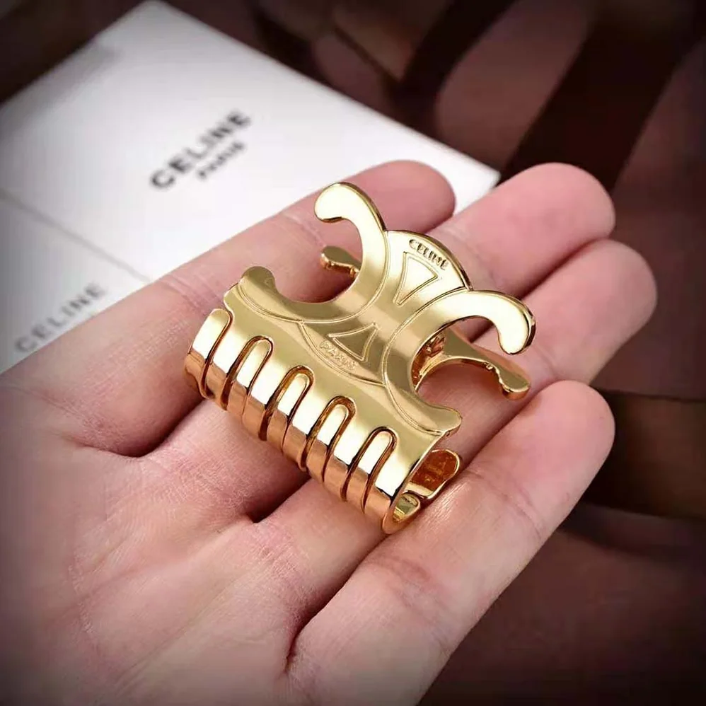 Celine Triomphe Medium Hair Claw in Zamak and Steel with Gold Finish for Women Celine Triomphe Medium Hair Claw in Zamak and Steel with Gold Finish for Women