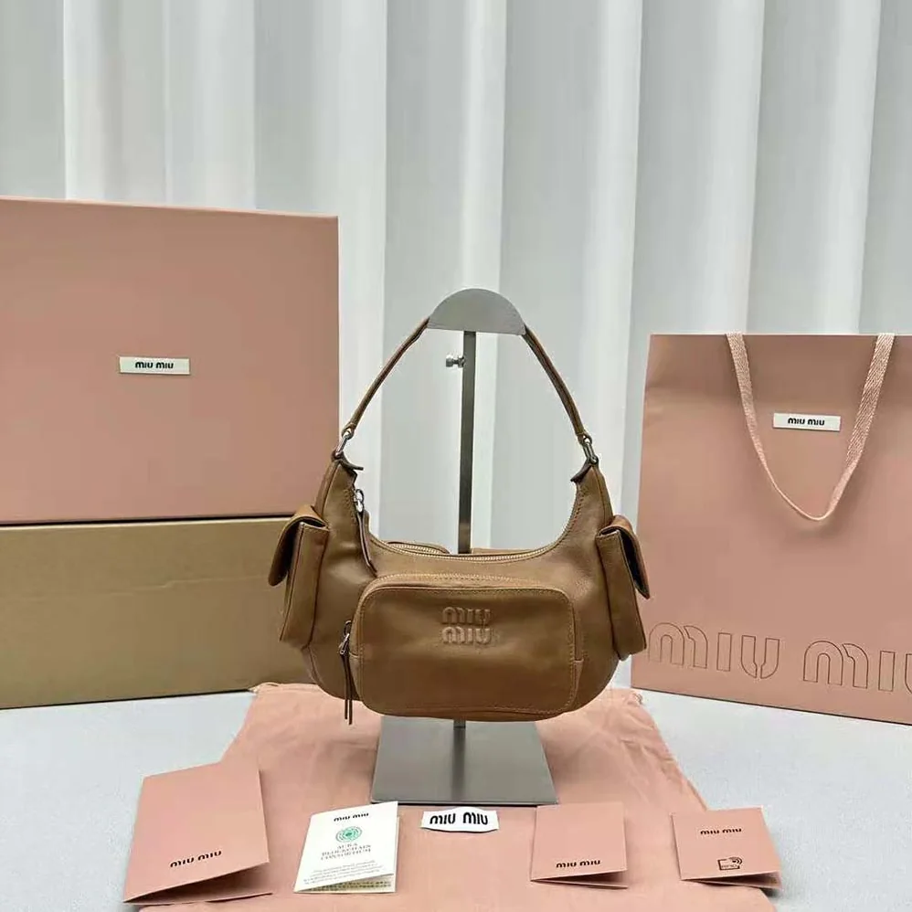 Miu Miu Pocket Nappa Leather Bag with Embossed Lettering Logo for Women in Brown Miu Miu Pocket Nappa Leather Bag with Embossed Lettering Logo for Women in Brown