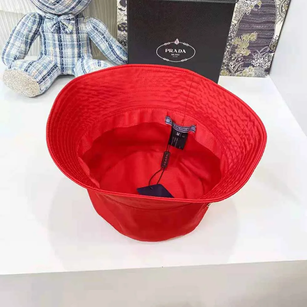 Prada Nylon Bucket Hat Decorated with the Triangle Logo for Women in Red