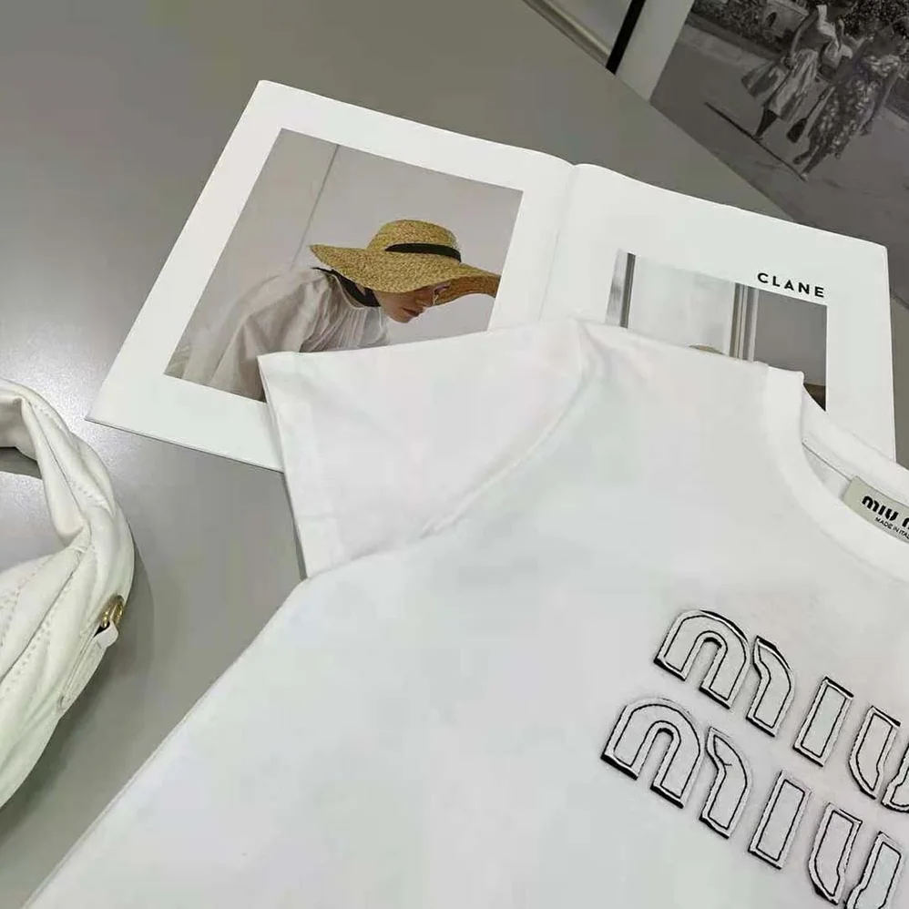 Miu Miu Embroidered Cotton T-shirt with Embroidered Logo for Women in White Miu Miu Embroidered Cotton T-shirt with Embroidered Logo for Women in White