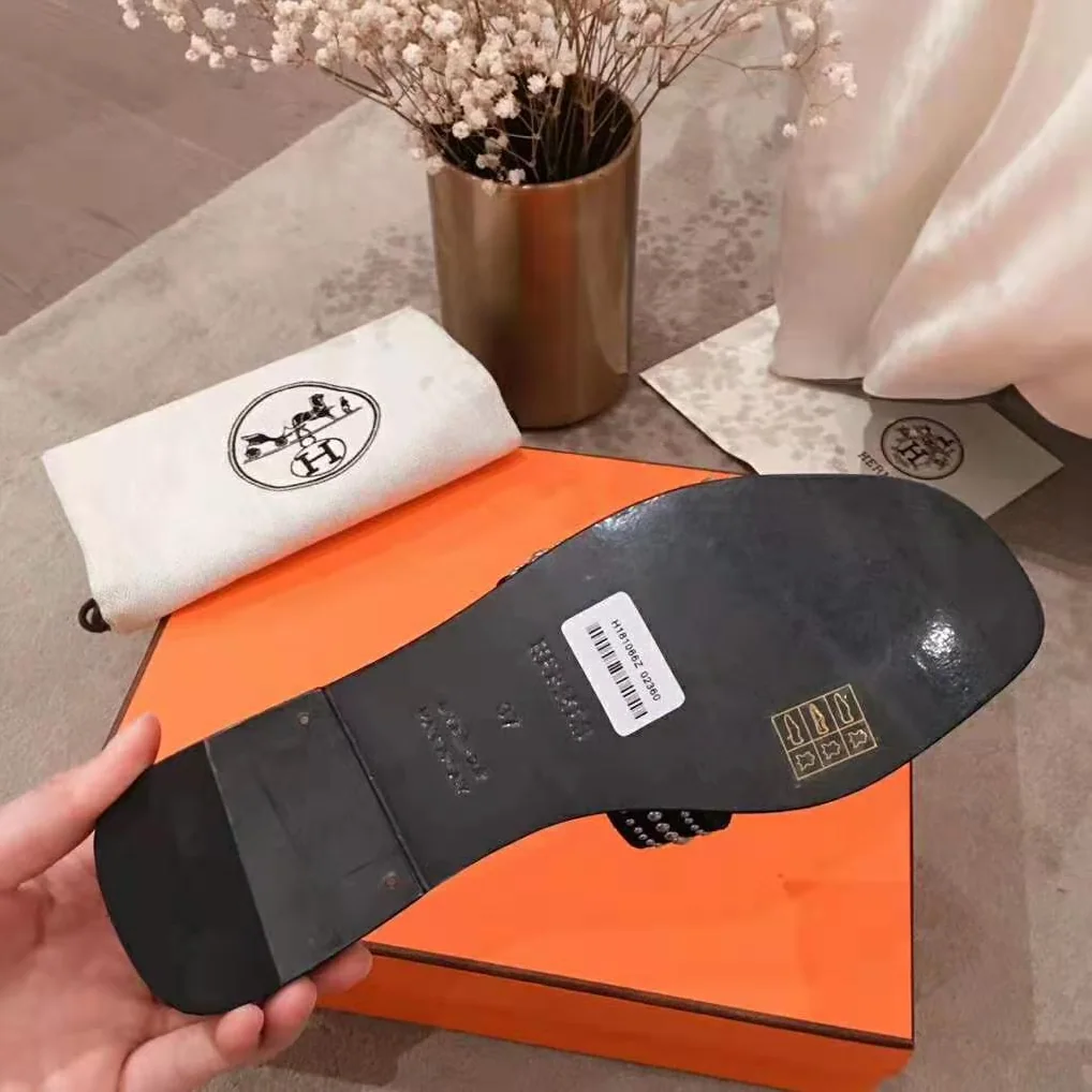 Hermes Oran Sandal in Suede Goatskin with Palladium Plated Studs and Iconic “H” Cut-Out for Women in Black