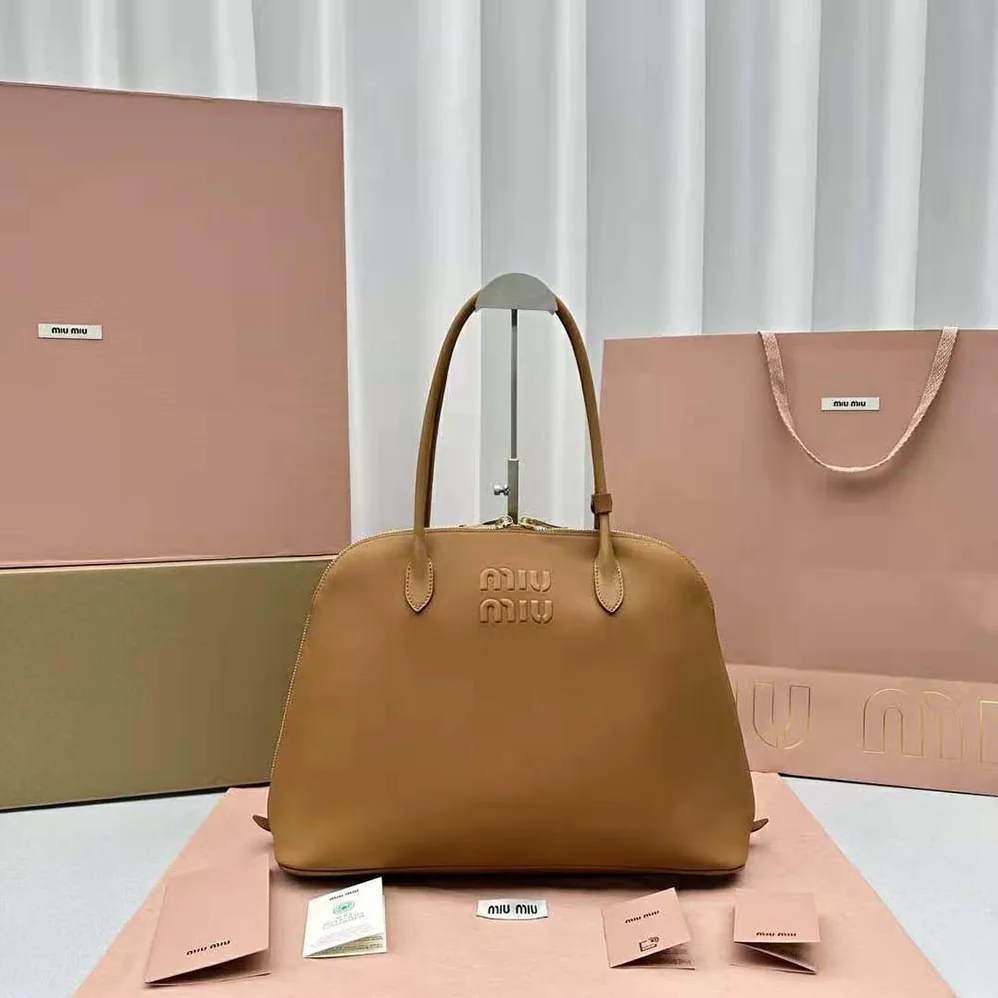 Miu Miu Leather Bag with Embossed Lettering Logo for Women in Brown Miu Miu Leather Bag with Embossed Lettering Logo for Women in Brown