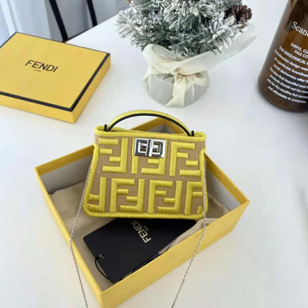 Fendi Nano Peekaboo Charm Gray FF Canvas Charm for Women in Yellow Fendi Nano Peekaboo Charm Gray FF Canvas Charm for Women in Yellow