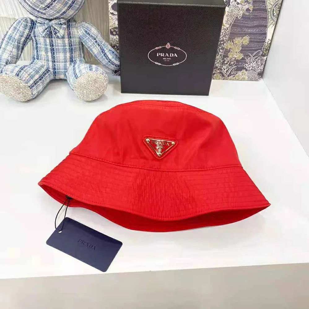 Prada Nylon Bucket Hat Decorated with the Triangle Logo for Women in Red