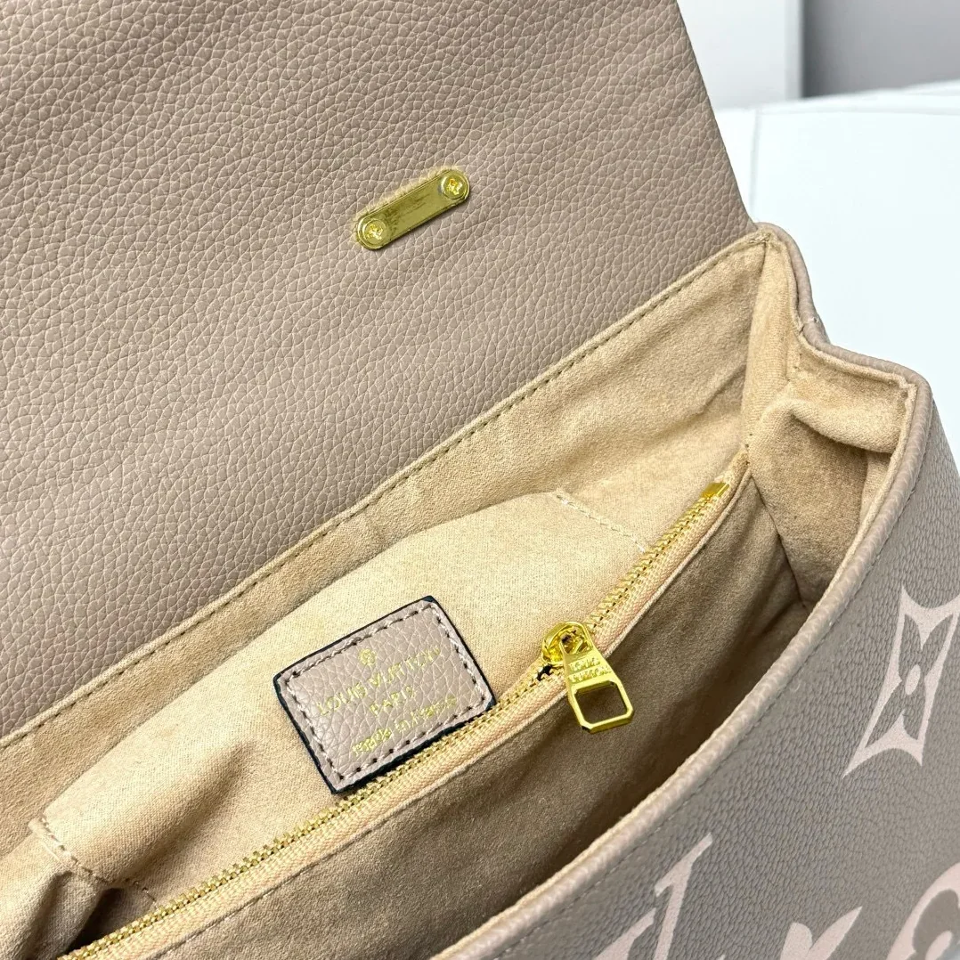 Louis Vuitton Madeleine MM Monogram Empreinte Dove Gray in Creme Beige