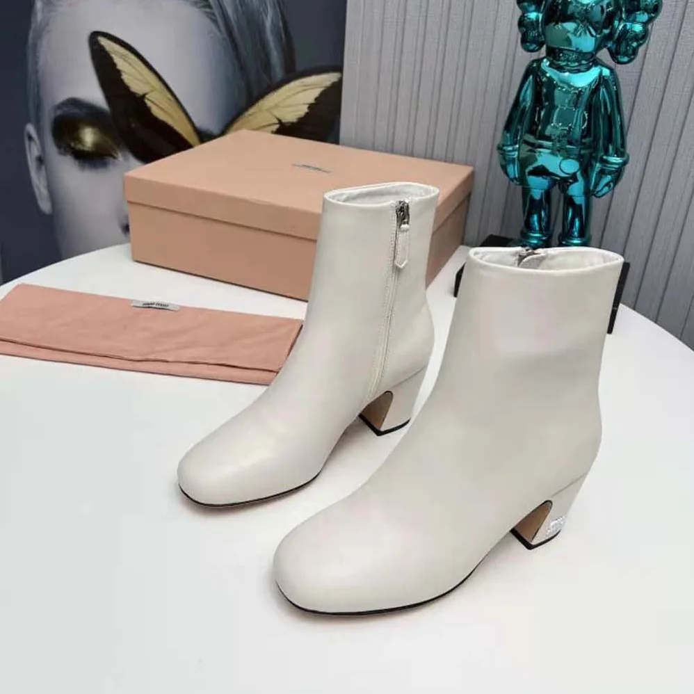 Miu Miu Leather Booties with Metal Lettering Logo for Women in White