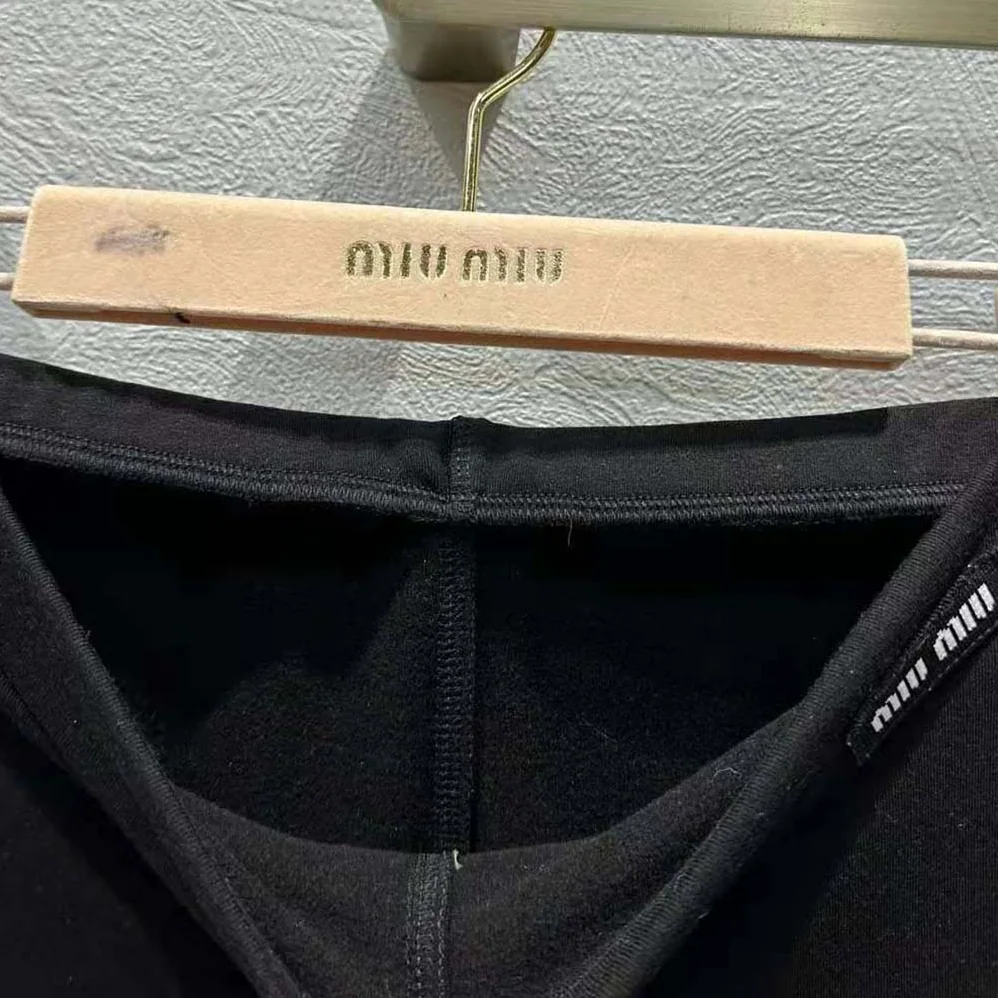 Miu Miu Silk Jersey Pants with Logo Patch for Women in Black Miu Miu Silk Jersey Pants with Logo Patch for Women in Black