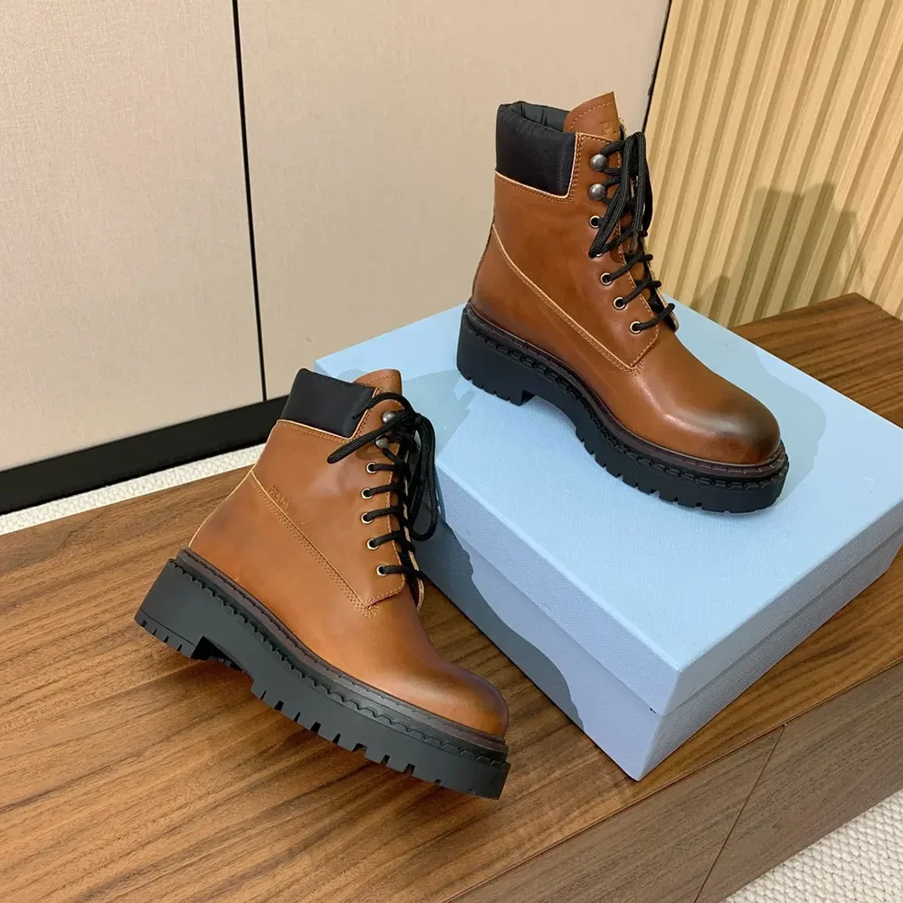 Prada Leather and Re-Nylon booties for Unisex in Ebony