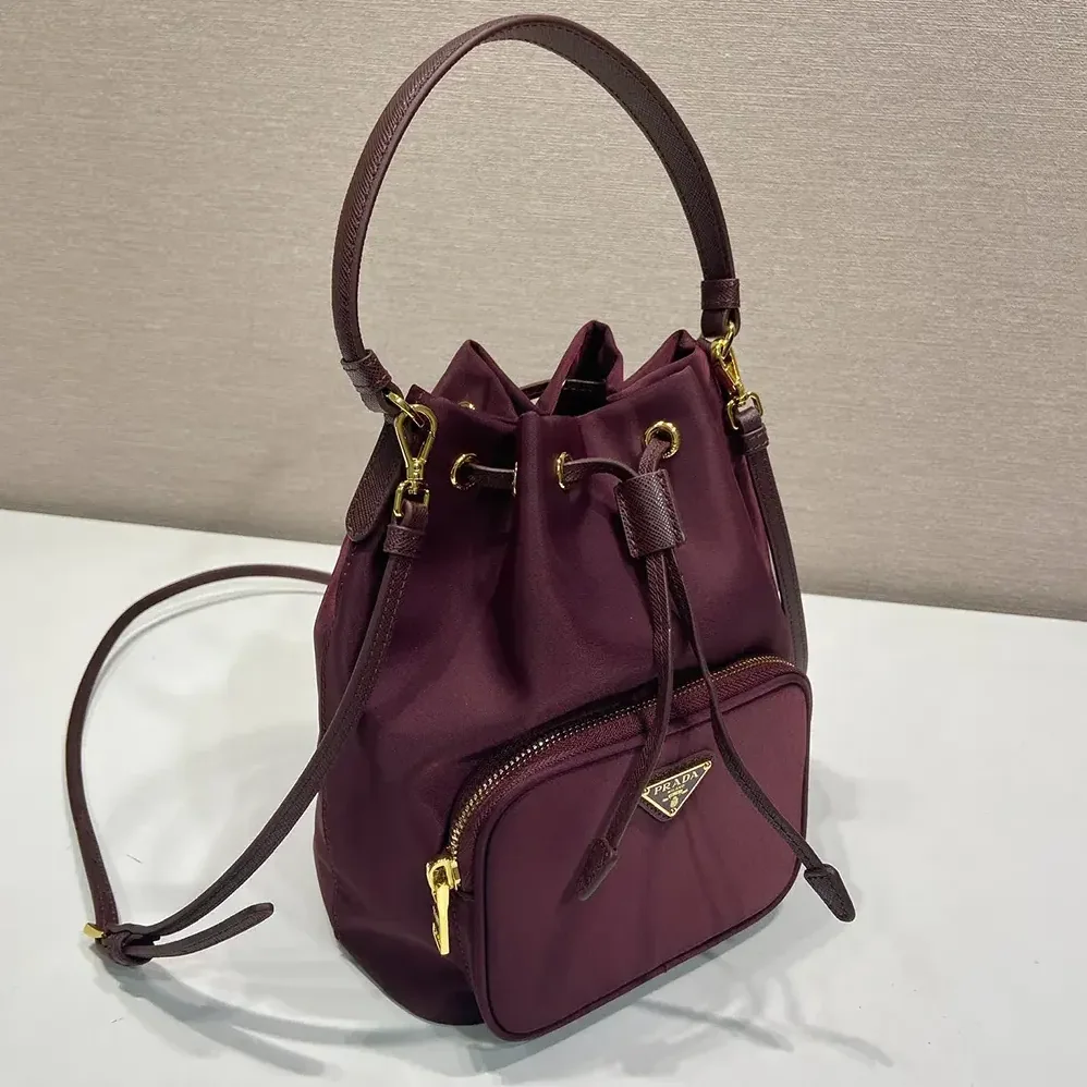 Prada Duet Re-Nylon Bucket Bag for Women in Maroon Prada Duet Re-Nylon Bucket Bag for Women in Maroon