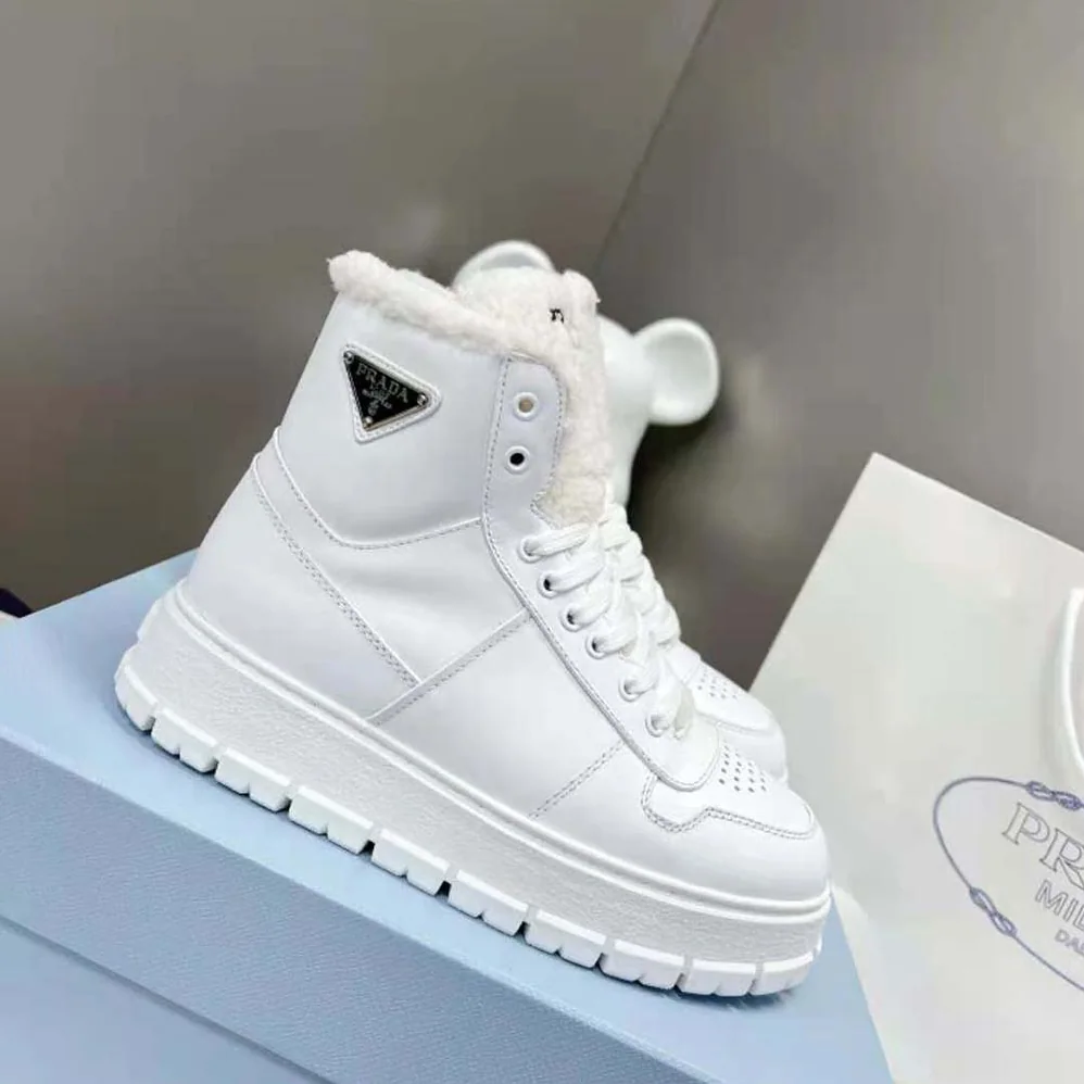 Prada Leather and Shearling High-Top Sneakers for Women in White Prada Leather and Shearling High-Top Sneakers for Women in White