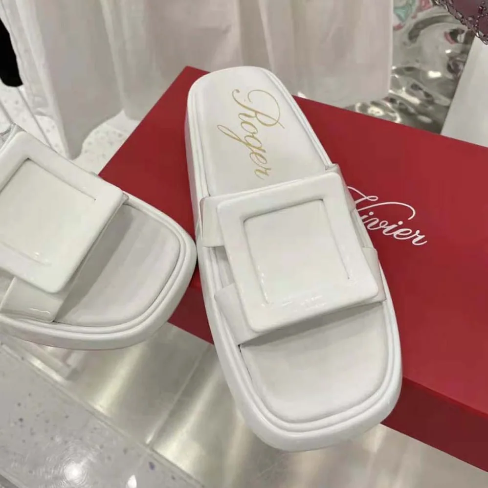 Roger Vivier Vivier Slide Covered Buckle Mules in Patent Leather for Women in White Roger Vivier Vivier Slide Covered Buckle Mules in Patent Leather for Women in White