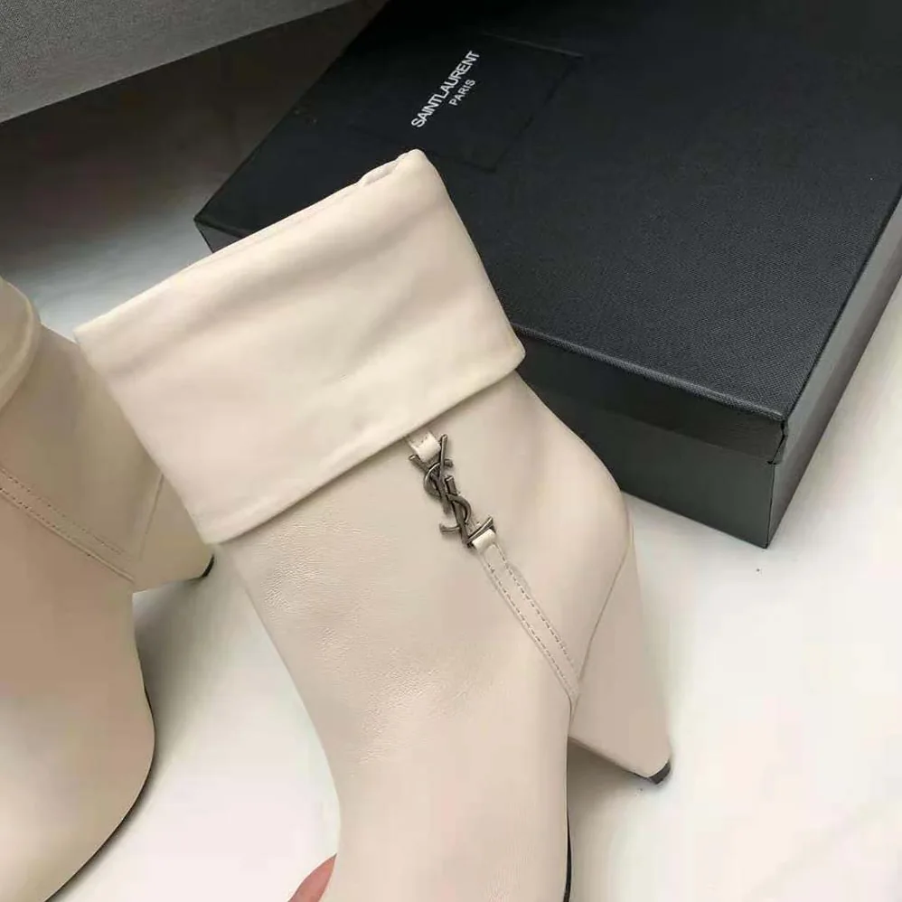 Saint Laurent YSL Niki Booties in Smooth Leather and Silver-Tone Monogram for Women in White Saint Laurent YSL Niki Booties in Smooth Leather and Silver-Tone Monogram for Women in White