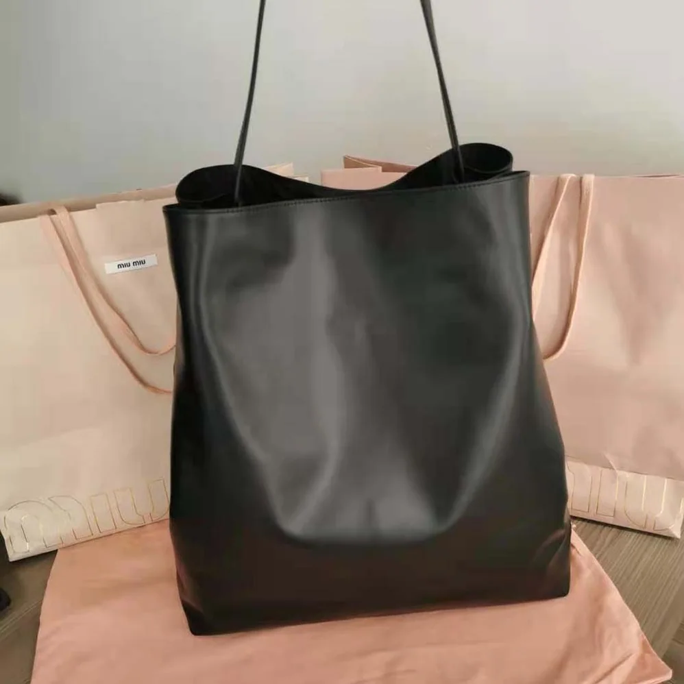 Miu Miu Leather Shoulder Bag with Embossed Lettering Logo on the Front for Women