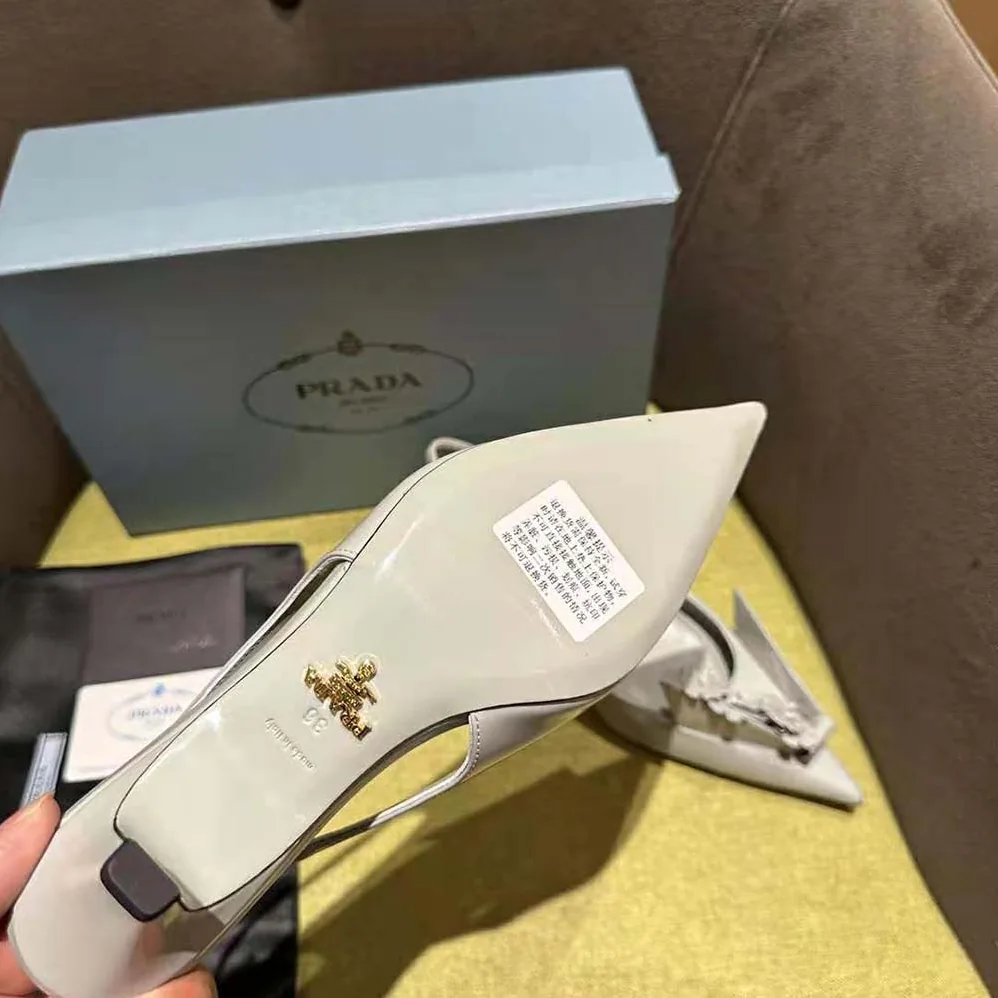 Prada Brushed Leather Slingback Pumps with Floral Appliques for Women in Gray Prada Brushed Leather Slingback Pumps with Floral Appliques for Women in Gray