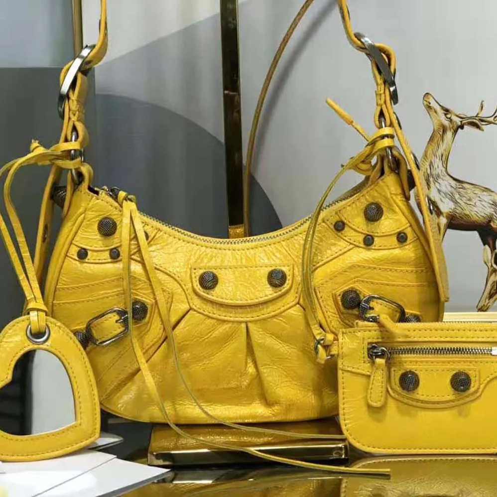 Balenciaga Le Cagole XS Shoulder Bag in Yellow for Women Balenciaga Le Cagole XS Shoulder Bag in Yellow for Women