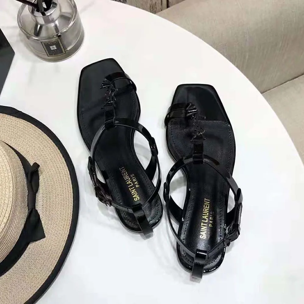 Saint Laurent YSL Cassandra Flat Sandals in Patent Leather with Silver for Women in Tone Monogram