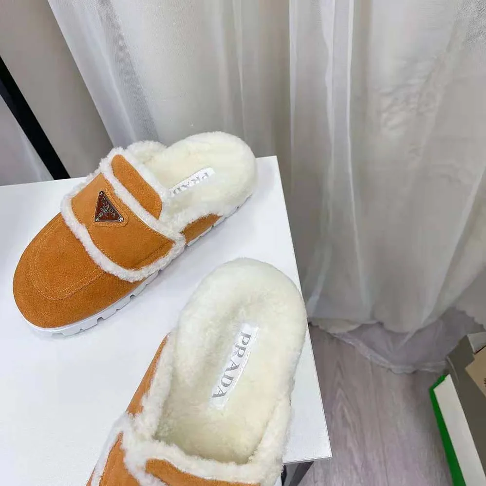 Prada Shearling Slippers Enameled Metal Triangle Logo for Women in Yellow Prada Shearling Slippers Enameled Metal Triangle Logo for Women in Yellow