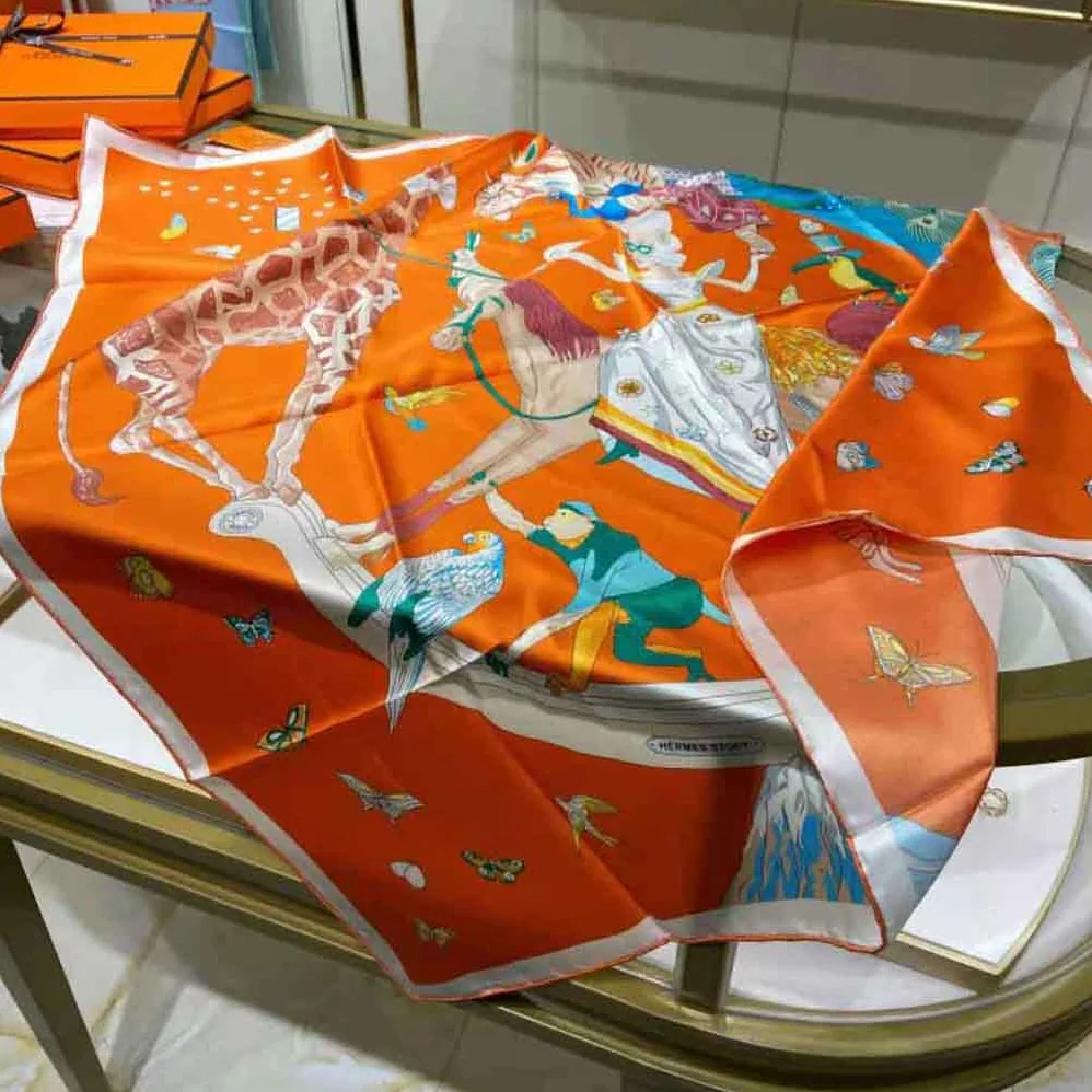 Hermes Hermes Story Scarf 90 in Silk Twill with Hand-Rolled Edges for Women in Orange
