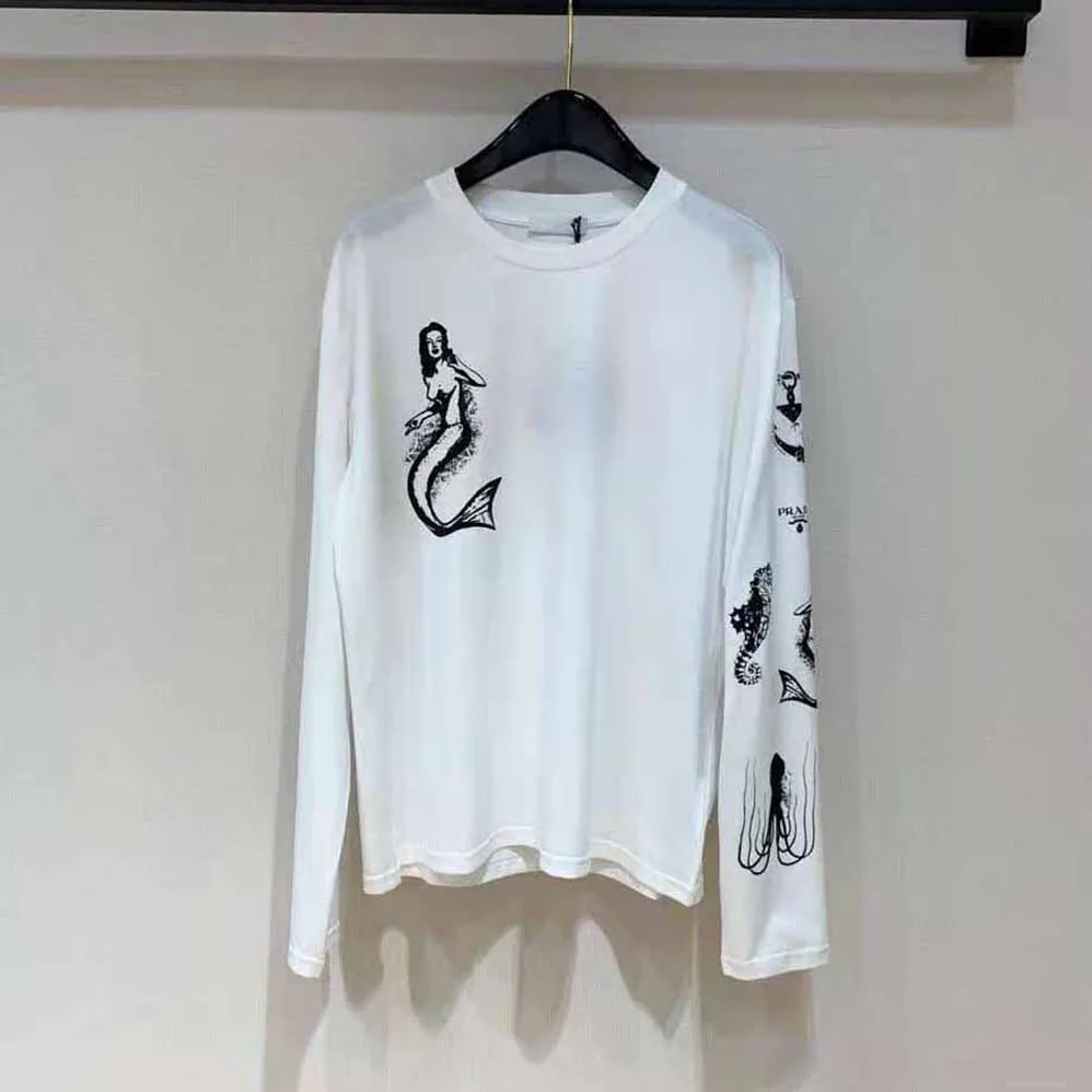 Prada Printed Cotton T-shirt with the Lettering Logo for Women in White Prada Printed Cotton T-shirt with the Lettering Logo for Women in White