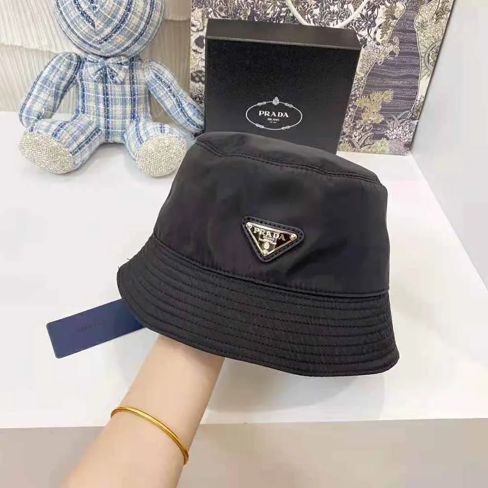 Prada Nylon Bucket Hat Decorated with the Triangle Logo for Women in Black Prada Nylon Bucket Hat Decorated with the Triangle Logo for Women in Black