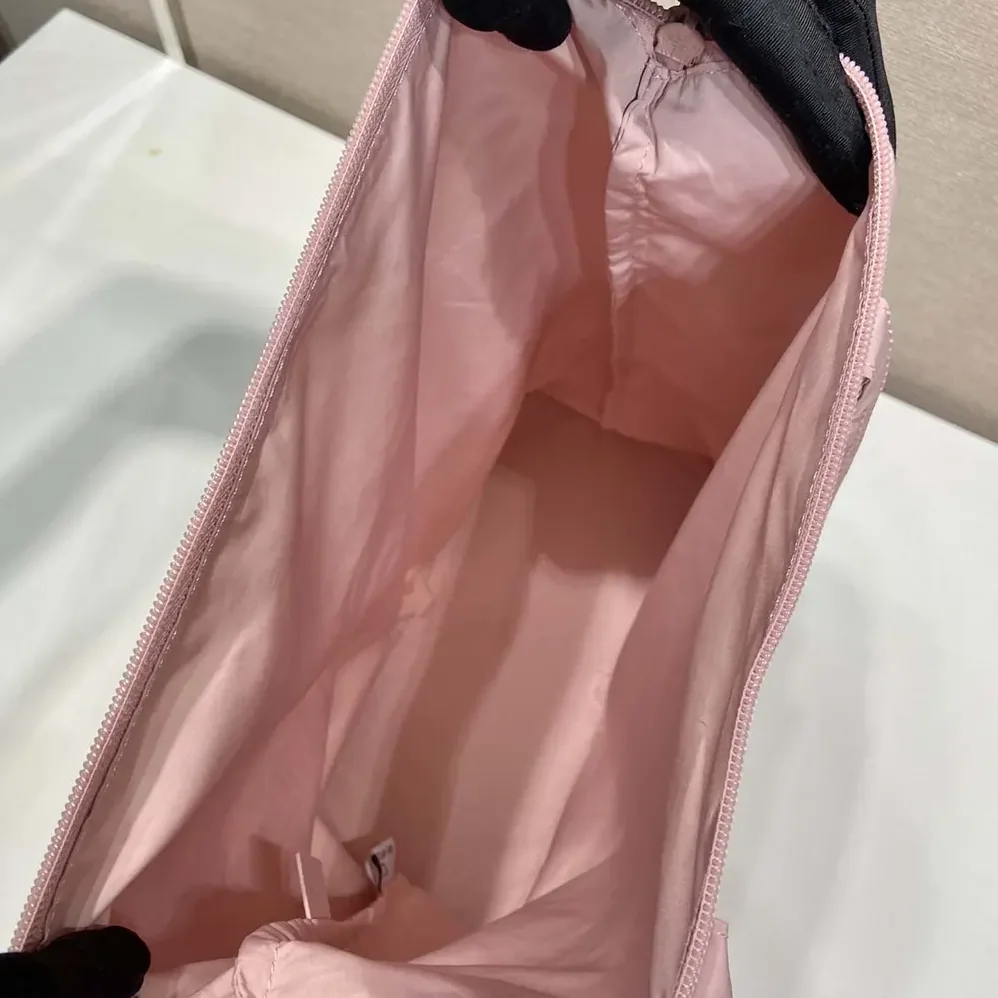 Prada Saffiano Leather Pendant With Re-Nylon Tote Bag for Women in Peach Prada Saffiano Leather Pendant With Re-Nylon Tote Bag for Women in Peach