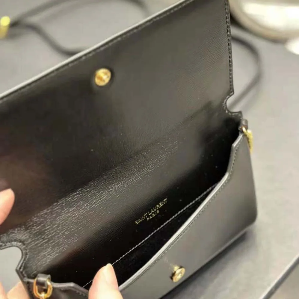 Saint Laurent YSL Cassandre Phone Holder with Strap in Smooth Leather for Women in Black Saint Laurent YSL Cassandre Phone Holder with Strap in Smooth Leather for Women in Black