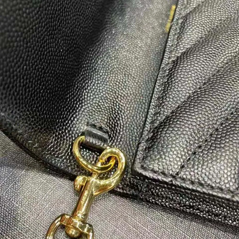 Saint Laurent YSL Monogram Clutch in Quilted Grain de Poudre Embossed Leather for Women in Black Saint Laurent YSL Monogram Clutch in Quilted Grain de Poudre Embossed Leather for Women in Black