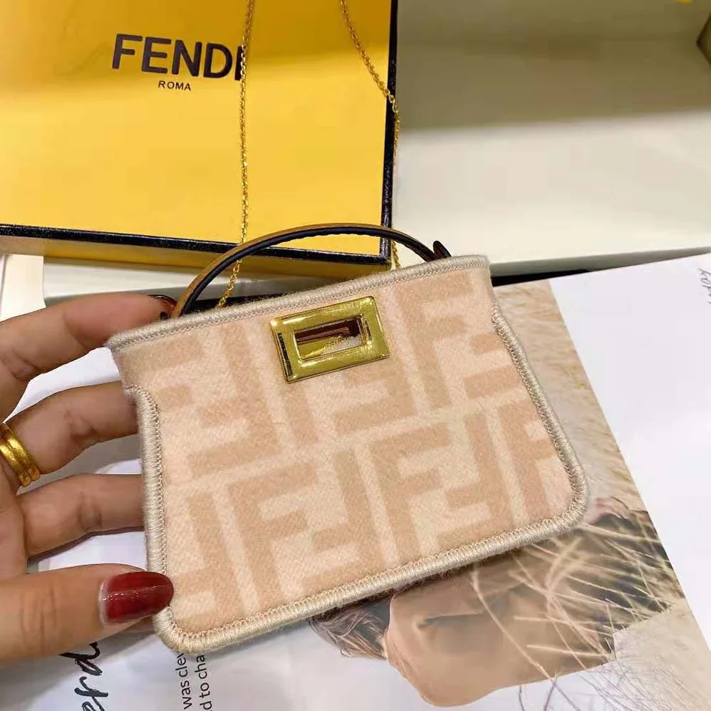 Fendi Nano Peekaboo Charm Beige Wool Charm for Women in Pink Fendi Nano Peekaboo Charm Beige Wool Charm for Women in Pink
