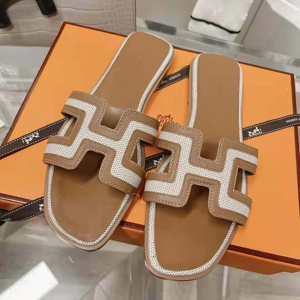 Hermes Oran Sandal in Calfskin and H Canvas with Iconic H Cut for Women in Out Hermes Oran Sandal in Calfskin and H Canvas with Iconic H Cut for Women in Out