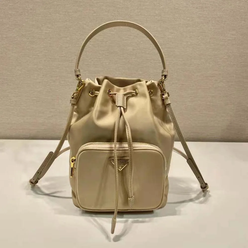 Prada Duet Re-Nylon Bucket Bag for Women in Beige