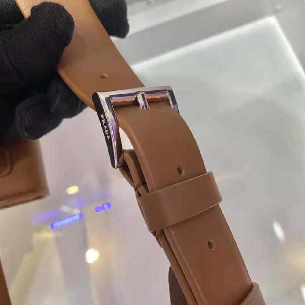Prada Leather Belt With a Hybrid Multifunctional Design for Women in Brown Prada Leather Belt With a Hybrid Multifunctional Design for Women in Brown