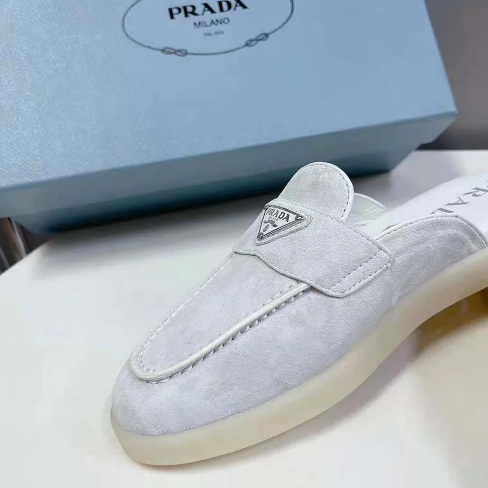 Prada Suede Leather Sabots with Enameled Metal Triangle Logo for Unisex in White