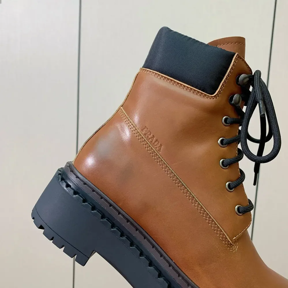 Prada Leather and Re-Nylon booties for Unisex in Ebony