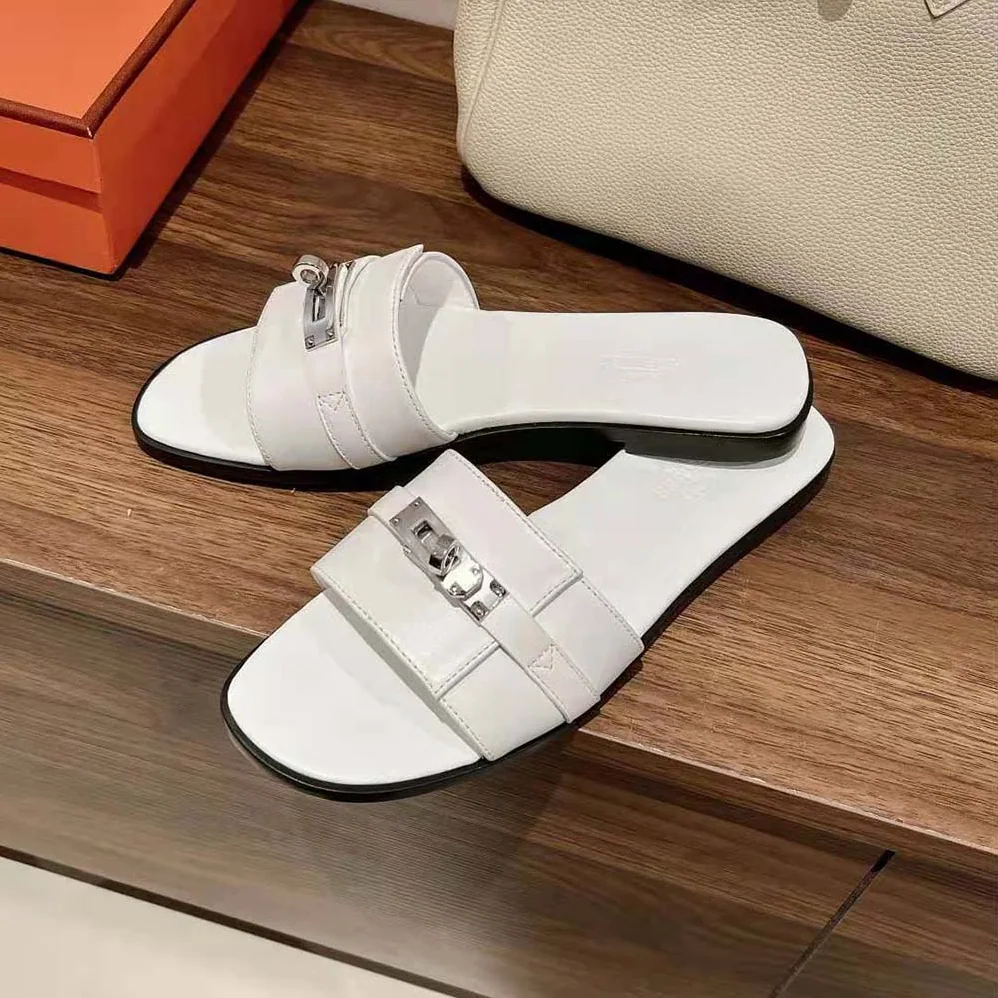 Hermes Giulia Sandal in Calfskin with Iconic Palladium-Plated Kelly Buckle for Women in White Hermes Giulia Sandal in Calfskin with Iconic Palladium-Plated Kelly Buckle for Women in White