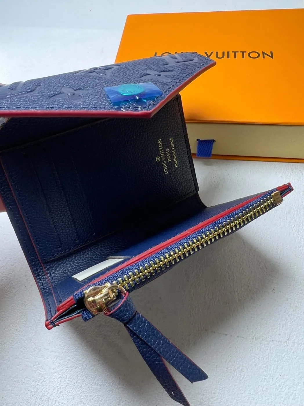 Louis Vuitton Victorine Wallet Monogram Empreinte Navy Blue in Red