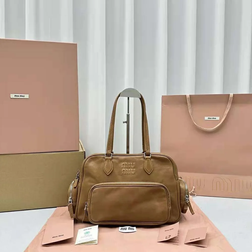 Miu Miu Nappa Leather Top-handle Bag with Embossed Lettering Logo for Women in Brown