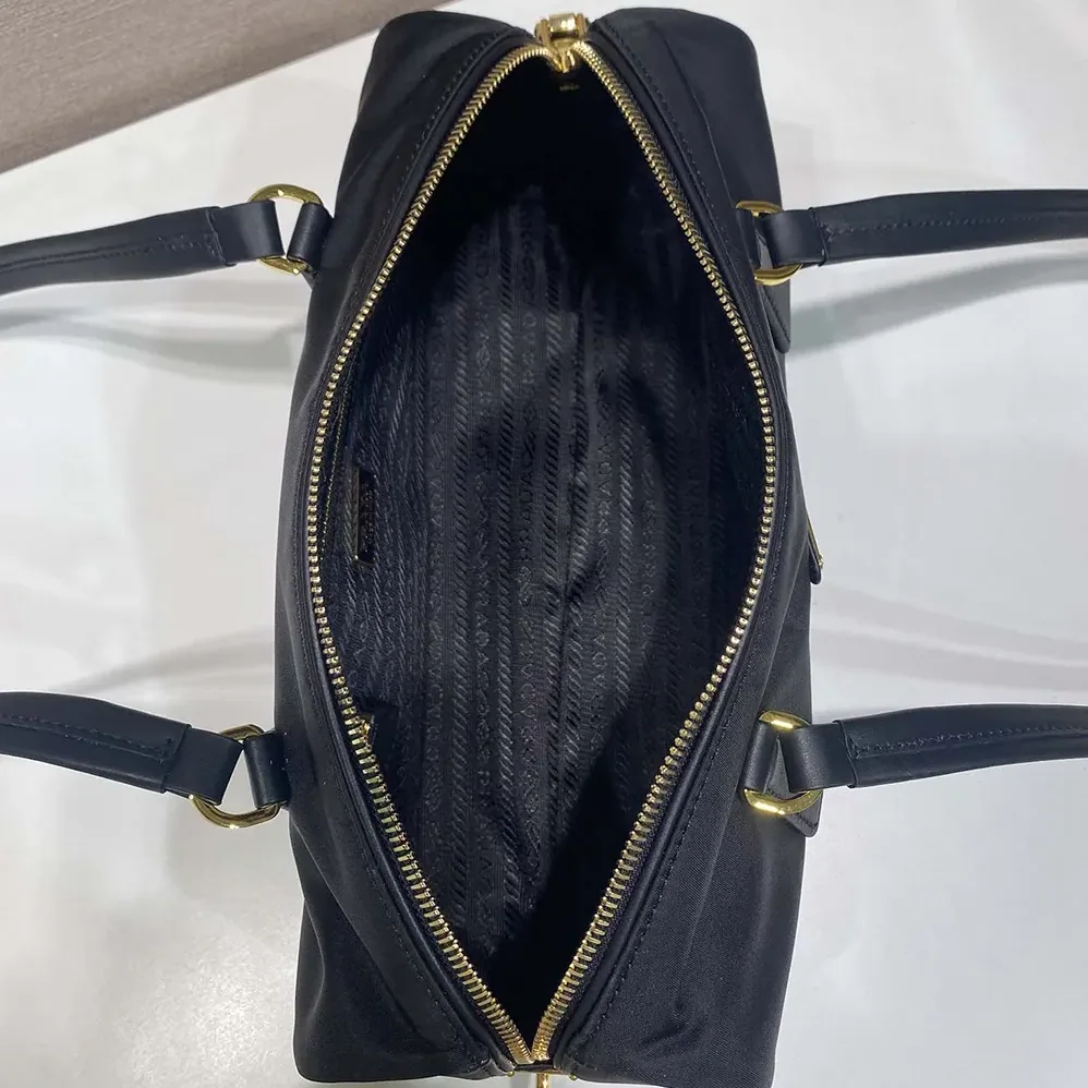 Prada Re-Nylon and Leather Medium Top-handle Bag with Padlock for Women in Black Prada Re-Nylon and Leather Medium Top-handle Bag with Padlock for Women in Black