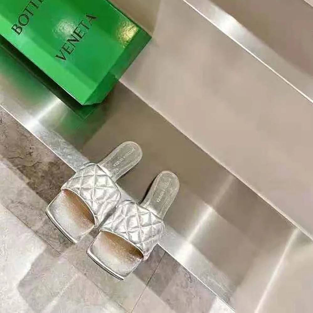Bottega Veneta Lido Flat Sandal Intreccio Metallised Leather Flat Sandals for Women in Silver
