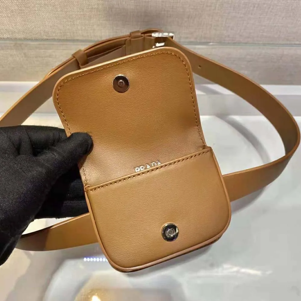 Prada Leather Belt With a Hybrid Multifunctional Design for Women in Brown Prada Leather Belt With a Hybrid Multifunctional Design for Women in Brown