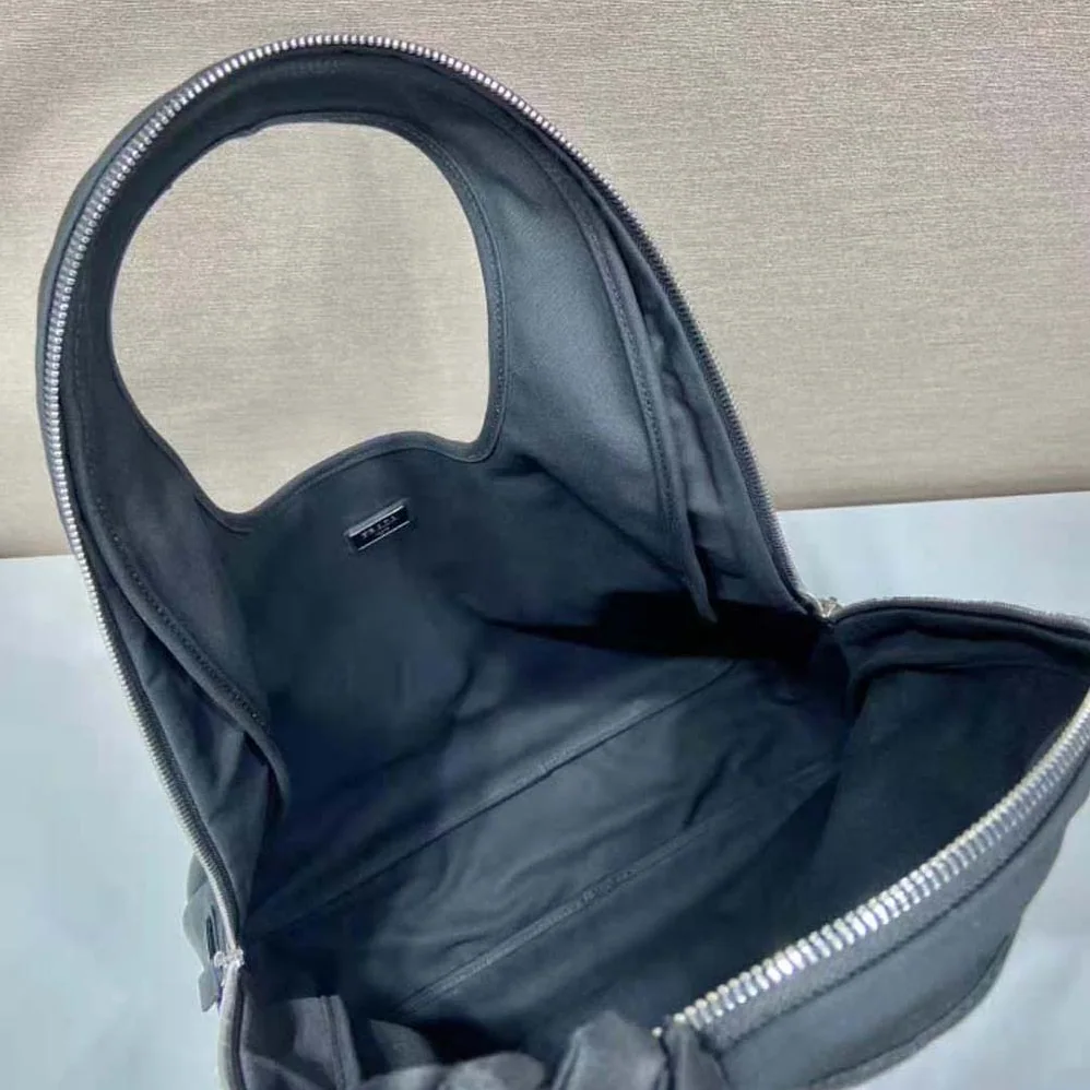 Prada Canvas Hobo Bag with Embossed Logo on the Front for Men in Black Prada Canvas Hobo Bag with Embossed Logo on the Front for Men in Black