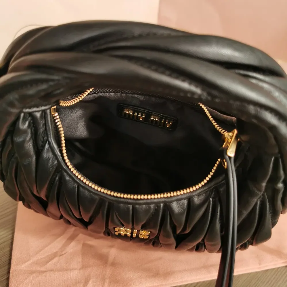 Miu Miu Wander Matelassé Nappa Leather Hobo Mini-Bag for Women in Black Miu Miu Wander Matelassé Nappa Leather Hobo Mini-Bag for Women in Black