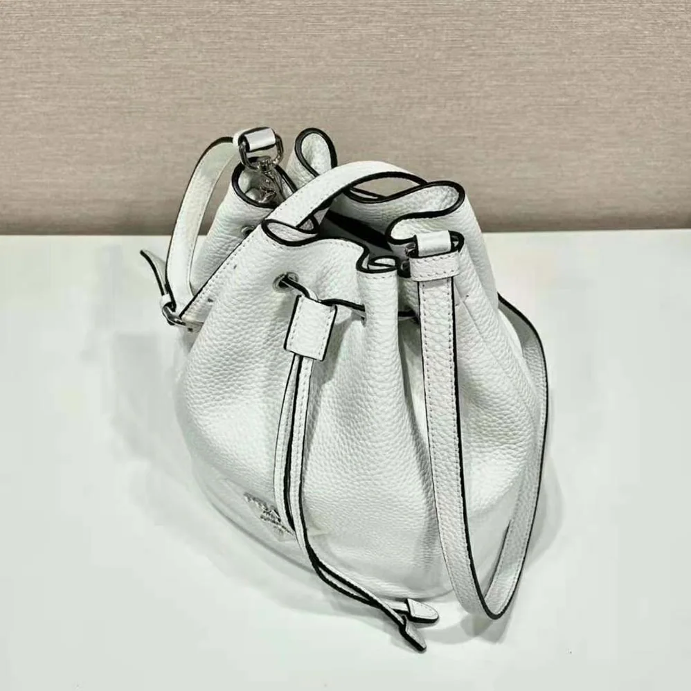 Prada Leather Bucket Bag with A Soft Silhouette for Women in White Prada Leather Bucket Bag with A Soft Silhouette for Women in White