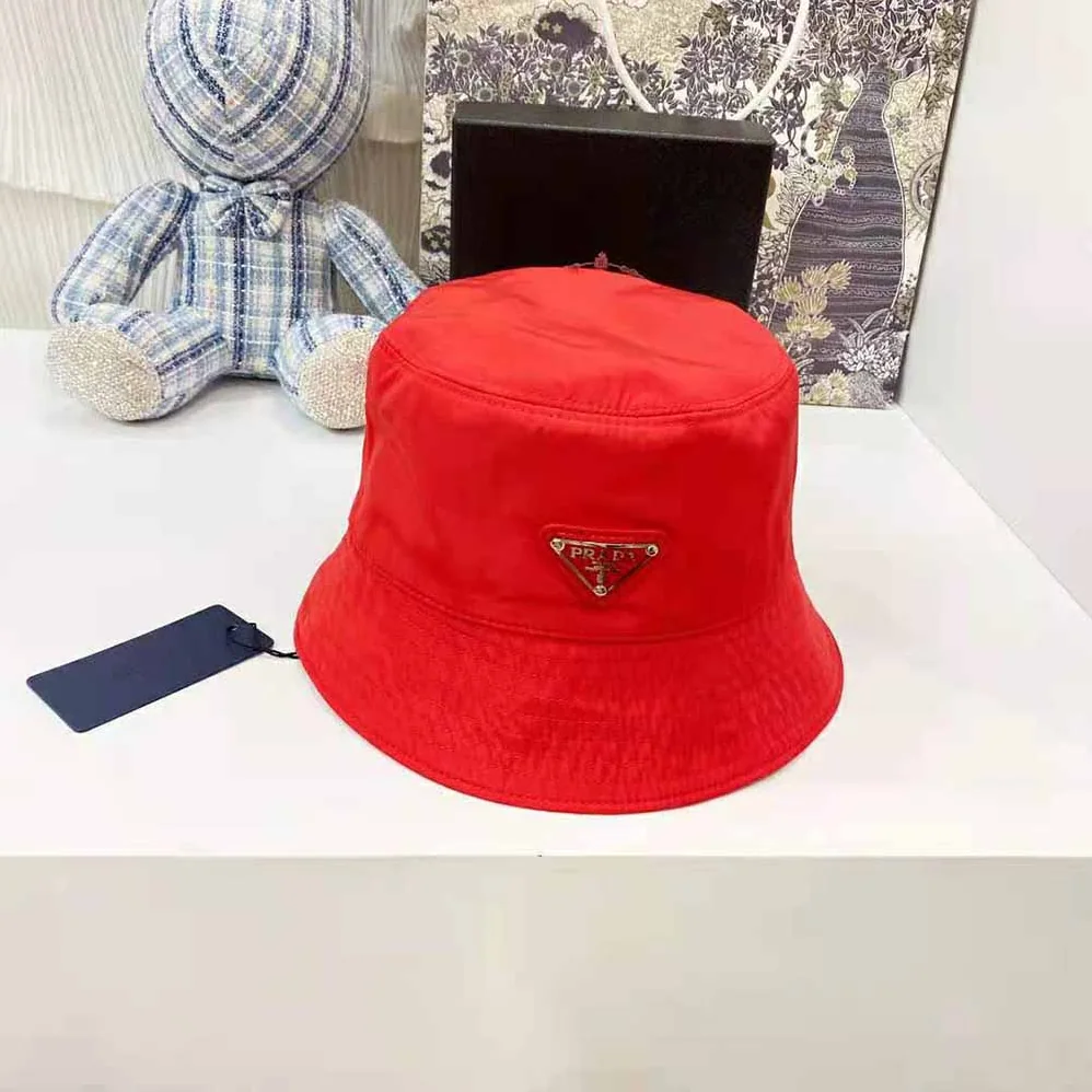 Prada Nylon Bucket Hat Decorated with the Triangle Logo for Women in Red
