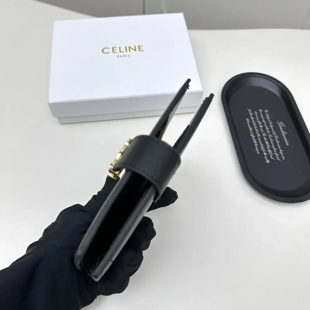 Celine Medium Strap Wallet Nino in Supple Grained Calfskin for Women in Black Celine Medium Strap Wallet Nino in Supple Grained Calfskin for Women in Black
