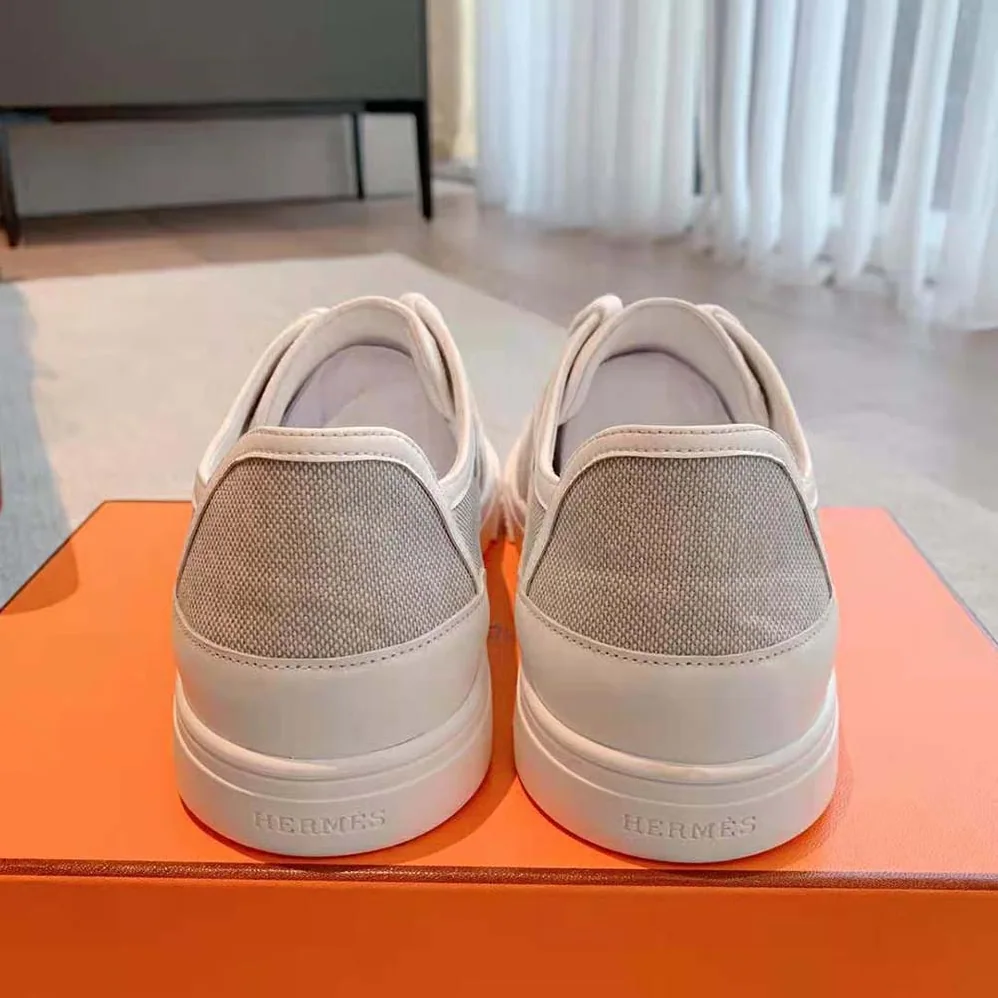 Hermes Get Sneaker in SH Canvas and Calfskin with Signature “Hermès Paris” Stencil for Unisex in Silver Hermes Get Sneaker in SH Canvas and Calfskin with Signature “Hermès Paris” Stencil for Unisex in Silver