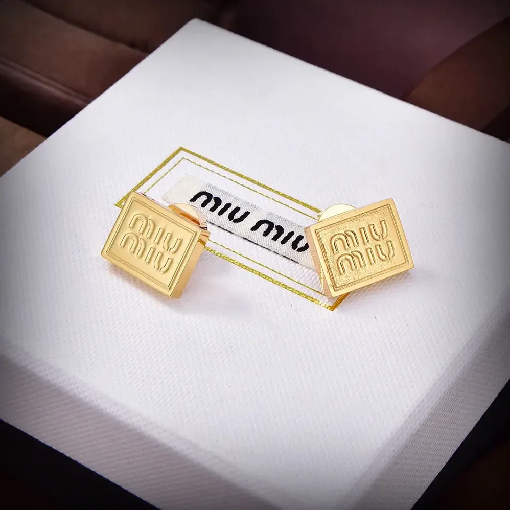 Miu Miu Metal Earrings with Visible Perforated Logo for Women Miu Miu Metal Earrings with Visible Perforated Logo for Women