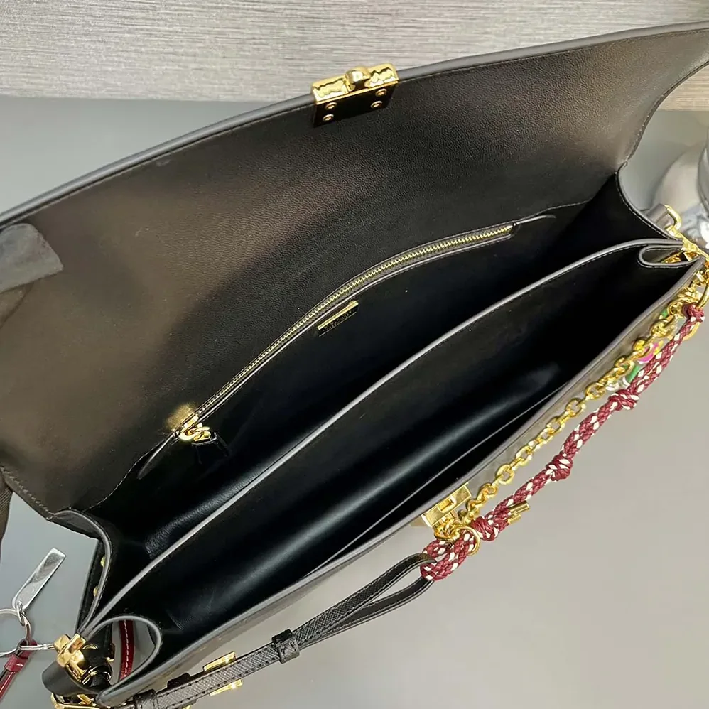 Prada Soft Sound Large Leather Shoulder Bag with Charms for Women in Black